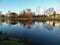 Winter atmosphere with colorful trees mirroring in the calm waters of a river