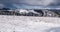 Winter austrian alps with wind turbines and peaks