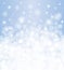 Winter background blurred, white & blue, with snowfall and copy space, for christmas card