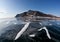 Winter Baikal with clear ice and reflection of rocks