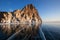 Winter Baikal with clear ice and reflection of rocks