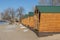 Winter beach on the river. Wooden gazebos on the beach in winter