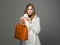 Winter beautiful Woman with orange Handbag