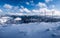 Winter Beskids mountains panorama with snow, hills and blue sky with clouds