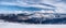 Winter Beskids mountains panorama with snow, hills and blue sky with clouds