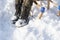 Winter boots on snow. Dark green warm winter boots closeup on sleigh background