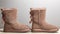 Winter brown felt boots on a white background