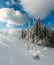 Winter calm mountain landscape with beautiful frosting trees and snowdrifts on slope Carpathian Mountains, Ukraine. Composite