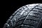 Winter car tires with snow wheel profile structure on black background - Close up