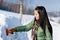 Winter car - woman remove snow from windshield