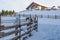 Winter chalet in mountain. Trails and path of hikers on the snow