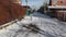 Winter. A child running around a snowy street