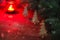 Winter Christmas Backgroun. Christmas Tree. Burning red candle. Snow Falling Effect. Dark image.