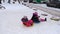 Winter Christmas fun for children. Kids ride an ice slide. Winter games, sports, leisure and fun