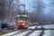 Winter city roads, freezing fog and educational tram