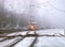 Winter city roads, freezing fog and educational tram