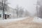 Winter cityscape of a provincial town. Snow-covered road