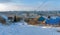 Winter cityscape, snowy descent - ascent, destruction of long-term construction.Sparse vegetation. Kamyshin city, Russia.