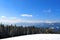 Winter climbing and skiing. Healthy lifestyle, tourism, adventure and sport. Panorama of Carpathian Mountains from top