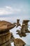 Winter clings to the hoodoos as spring arrives in the badlands. Drumheller Alberta,Canada