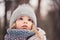 Winter close up outdoor portrait of adorable dreamy baby girl