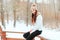 winter close up portrait of beautiful young woman in knitted hat and sweater