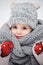 Winter close up vertical portrait of adorable smiling baby girl in grey knitted hat and scarf