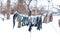 Winter. Clothes are drying on the street. Clothes covered with snow dries on a tightened rope