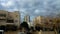 Winter colors of Israel. Blue sky with white clouds. White stone cities.