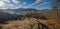 Winter coming. Last good weather days in autumn mountain countryside. Dirty road from hills to the village. Hoverla and Petros