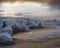 Winter coming. Picturesque pre sunrise scene above late autumn mountain countryside with hoarfrost on grasses, trees, slopes.