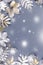 Winter concept flat lay with golden and silver leaves with snow falling. Christmas frame background