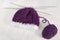 Winter concept: purple bonnet & knitting needles