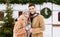 Winter Couple. Portrait Of Happy Young Lovers Posing Outdoors Near Campervan Motorhome