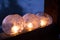 Winter craft: Ice lanterns with flickering fire of a candle