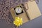 Winter creative cozy flat lay. Blank open notepad, new year pink beads clock, gift box with yellow bow. View from above