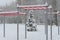 Winter cyclone. Snowfall in the city. Sports ground covered with snow.