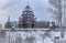 Winter day in the forest Park. Wooden Pokrovsky Cathedral, a monument of wooden architecture