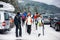 Winter day with snow with rear view of group of friends in skiin