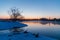 Winter daybreak beginning over foggy river