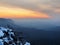 Winter daybreak in sandstone rocks of Bohemian-Saxon Switzerland park. View from the rock peak over valley.