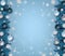 Winter and december christmas background with border of fir tree branches, snowflakes and balls.