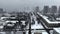 Winter Dnipro city in Ukraine and snow covered street with cars traffic from a bird eye view