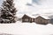 Winter dolomites cabin forest