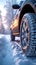 Winter driving close up of car tires on a snow covered road