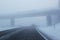 Winter driving in freezing fog on a country road