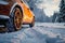 Winter driving Wheel of a car in a snowy setting