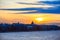 Winter embankment of Neva River in Saint Petersburg, Russia. Sunset in city and frozen river.