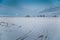 Winter evening in snowy fields of Russian province