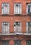 Winter facade of an old brick building in loft style. High Windows and textural materials